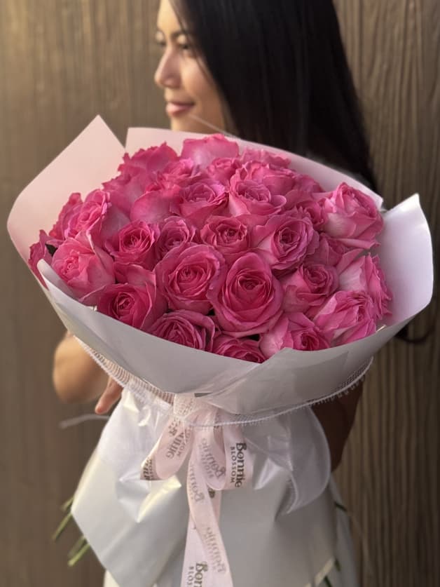 A charming bouquet of 31 candy-colored Holland roses