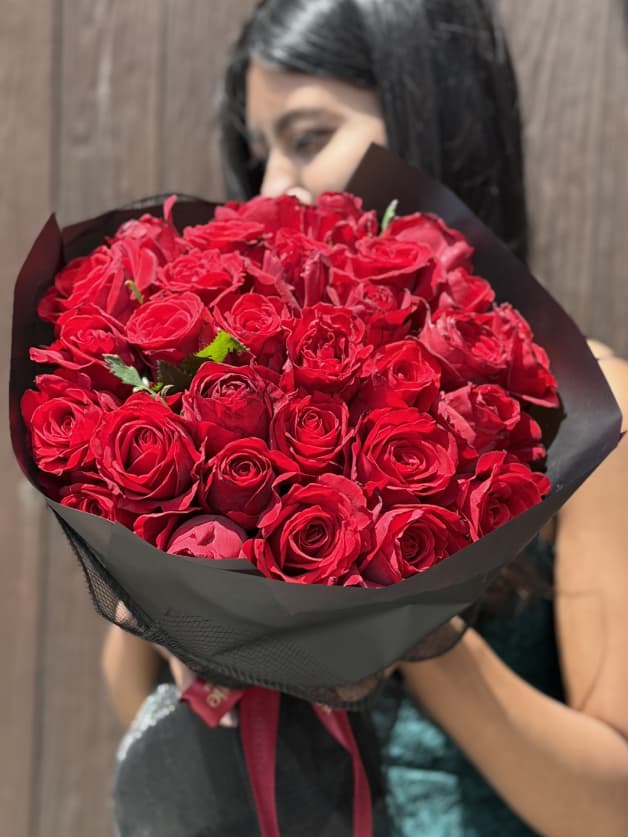 A passionate bouquet of 31 red Holland roses