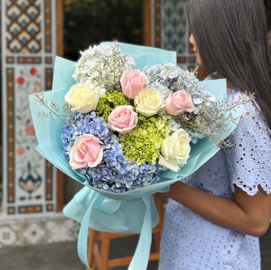 A dreamy mix of pastel hydrangeas and roses, perfect for gentle and heartfelt expressions.